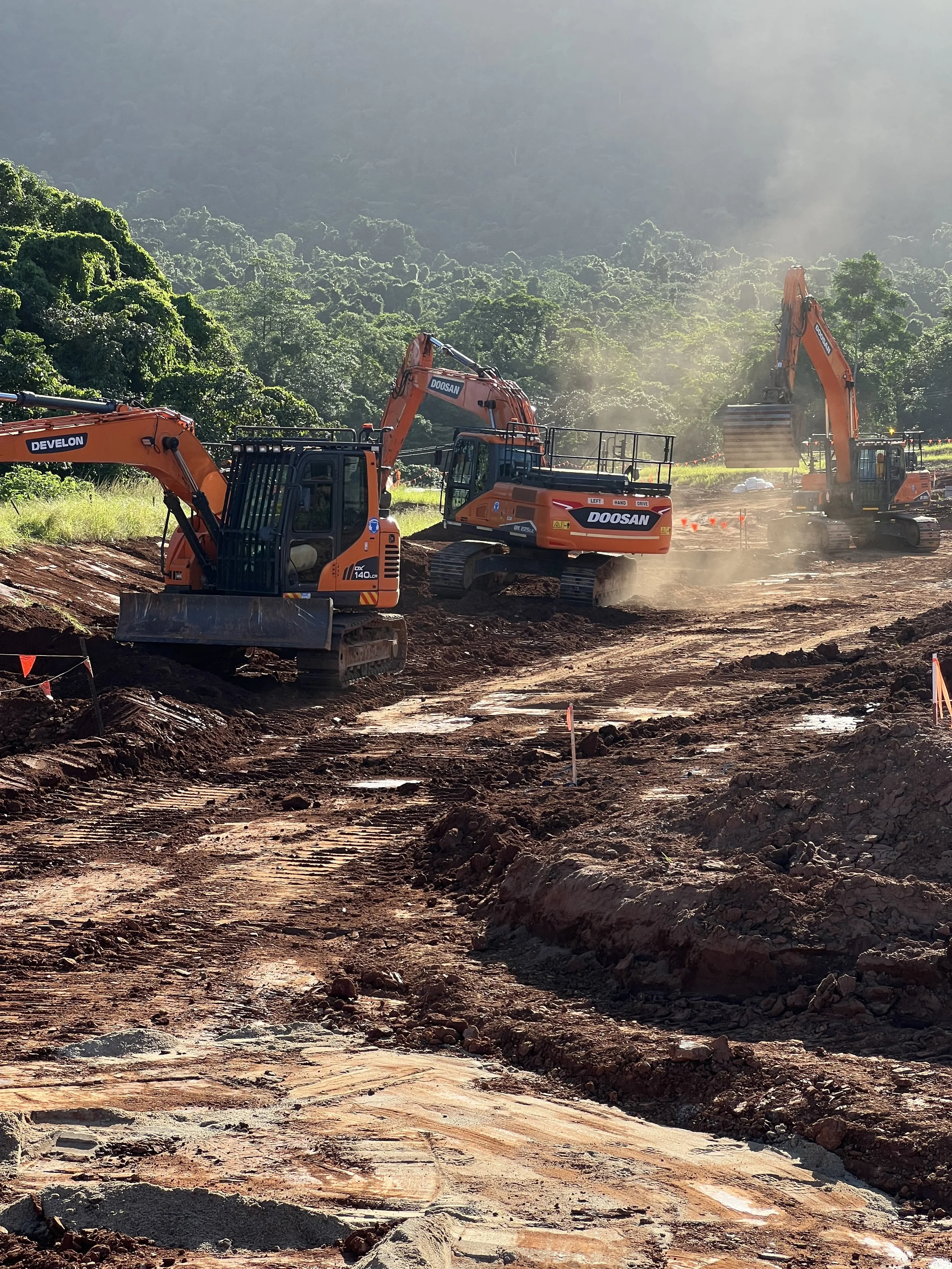 Excavators carrying out large-scale civil earthworks and trenching works in Far North Queensland