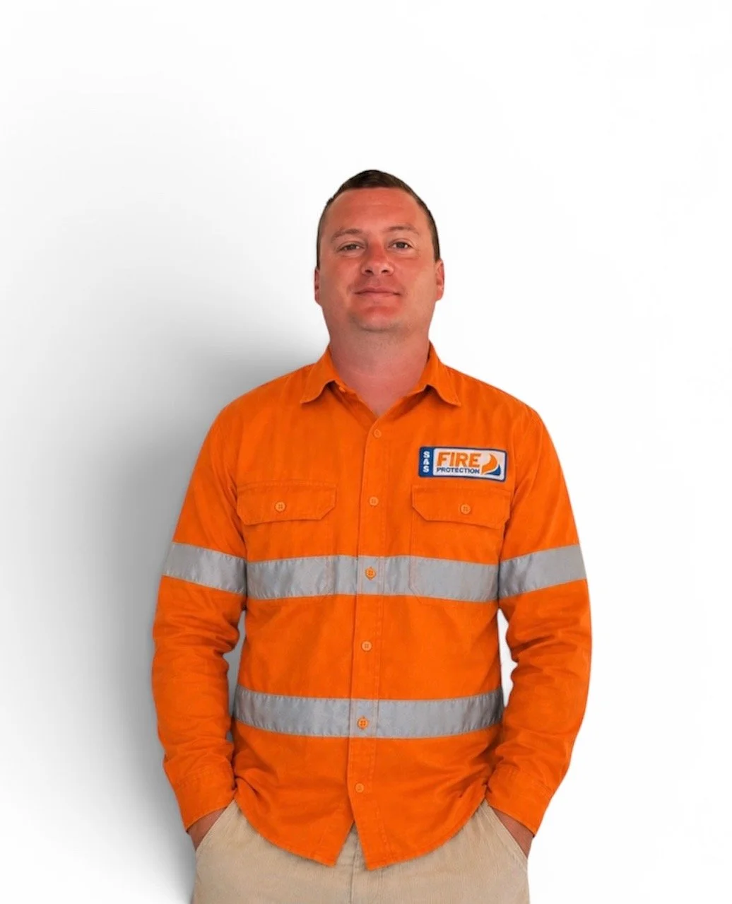 Man wearing an orange firefighter uniform with reflective stripes and a fire protection patch on the chest, standing against a white background.