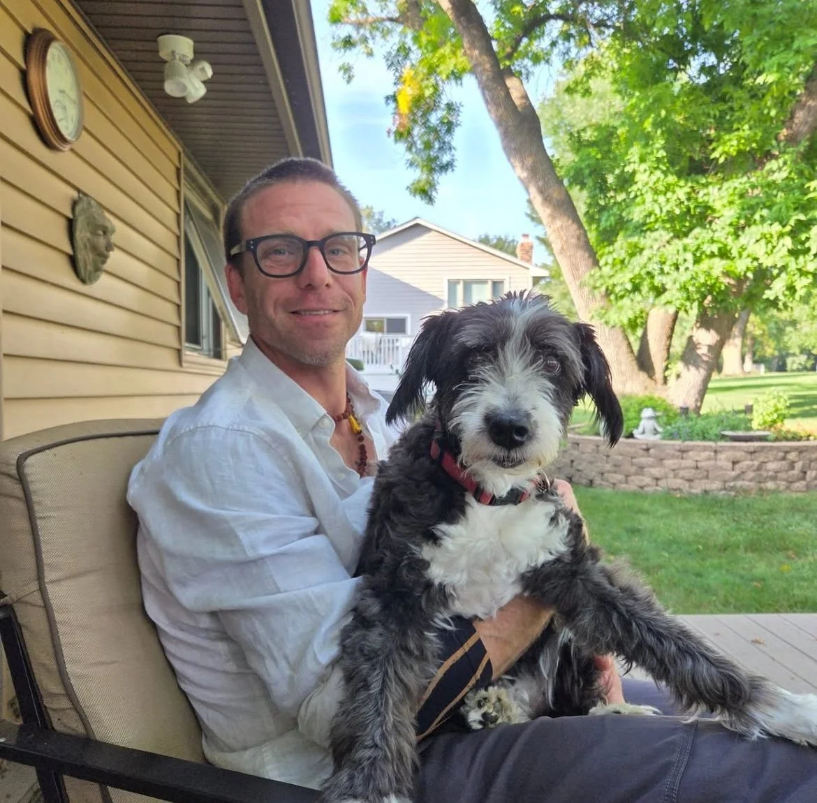 an arborist sits with the cutest on earth