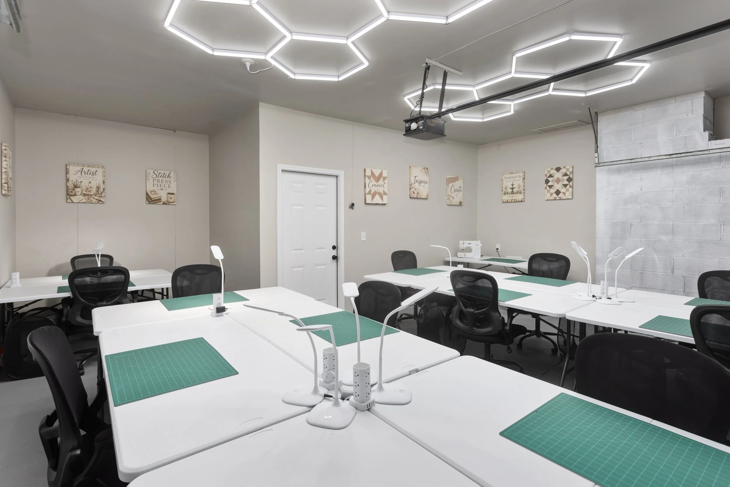Dedicated creative workspace at Fountain City Creative Retreat near Kansas City featuring spacious workstations, bright lighting, and purpose-built setup for scrapbook retreats, quilting weekends, and private creative group stays.