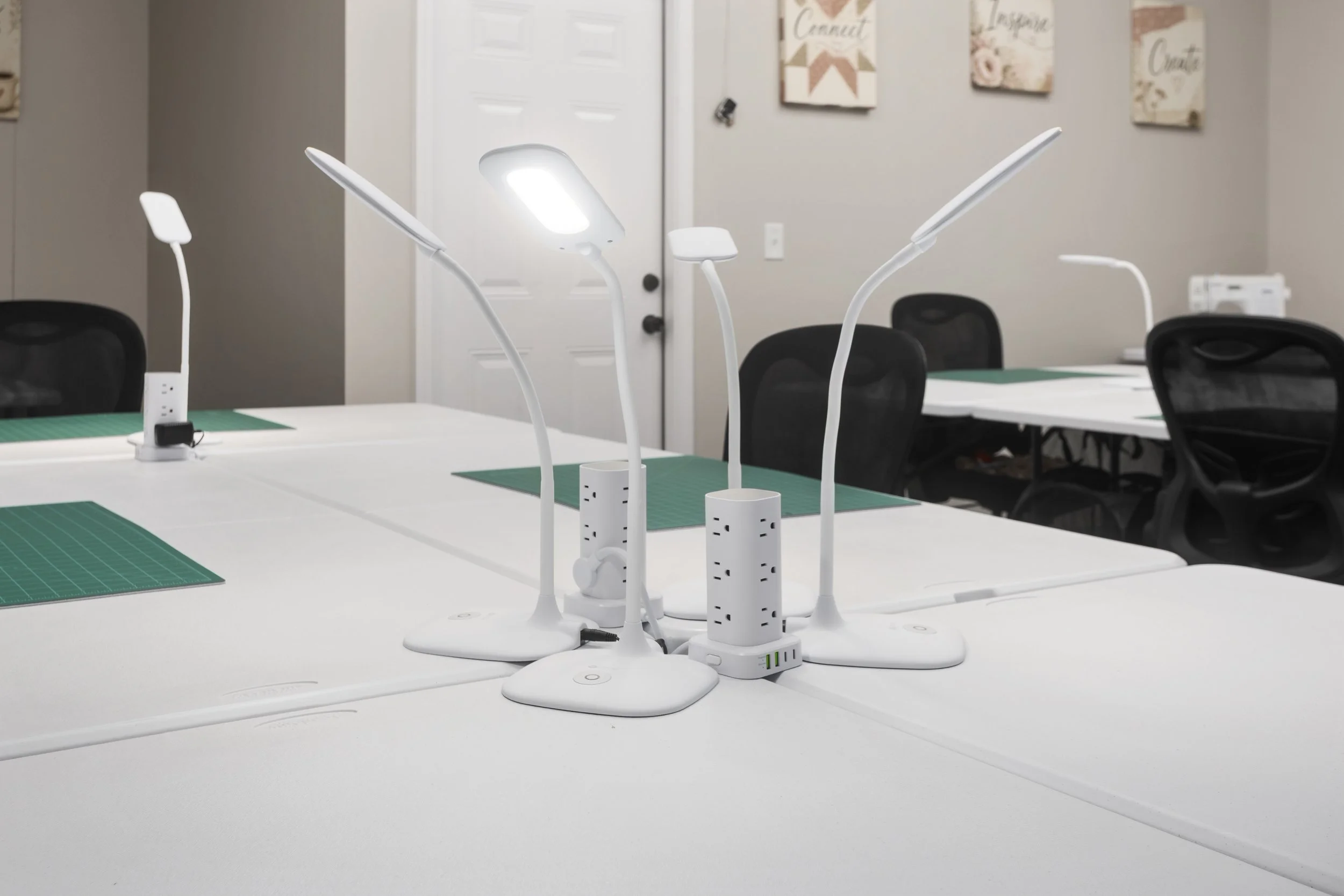 Purpose-built creative workspace at Fountain City Creative Retreat featuring personal task lighting, dedicated power access, and thoughtfully designed workstations built for scrapbookers, quilters, and makers near Kansas City.