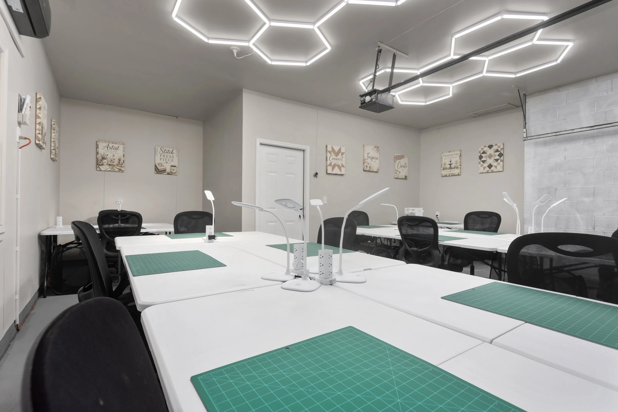 Dedicated creative workspace at Fountain City Creative Retreat near Kansas City featuring spacious crafting tables, ergonomic seating, task lighting, and a group-friendly setup designed for scrapbook retreats, quilting weekends.