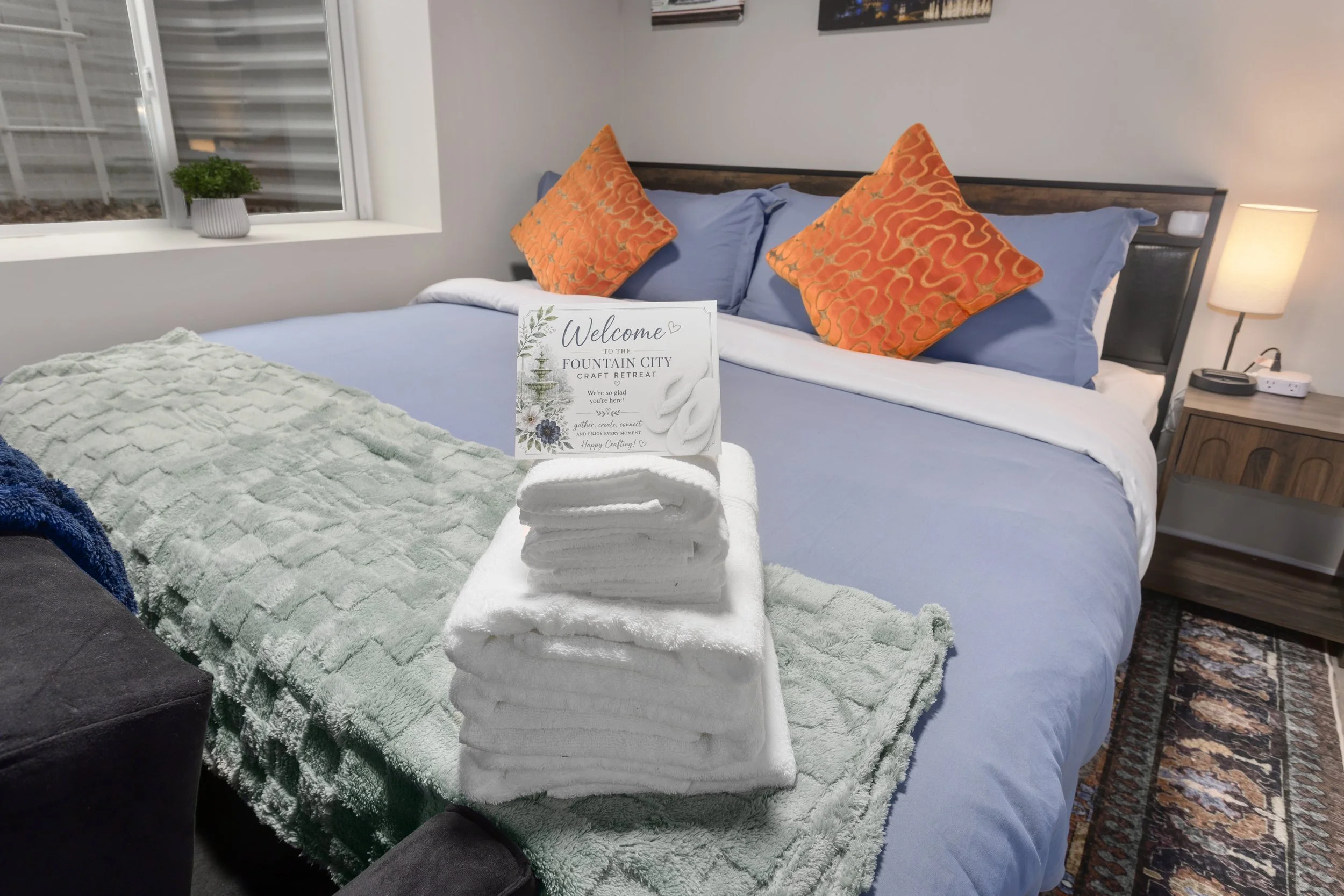 Comfortable boutique-style bedroom accommodations at Fountain City Creative Retreat featuring multiple sleeping arrangements for creative groups, scrapbook retreats, quilting weekends, and private retreat stays near Kansas City.