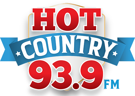 Logo for HOT 93.9 FM radio station with red, white, and blue design elements.
