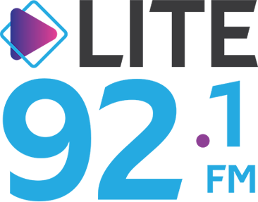 Logo for Lite 92.1 FM radio station, featuring a stylized play button icon and bold text.