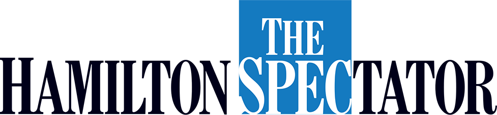 The logo of 'The Spectator' features a blue square with white text, overlapping a larger black text that says 'HAMILTON.'