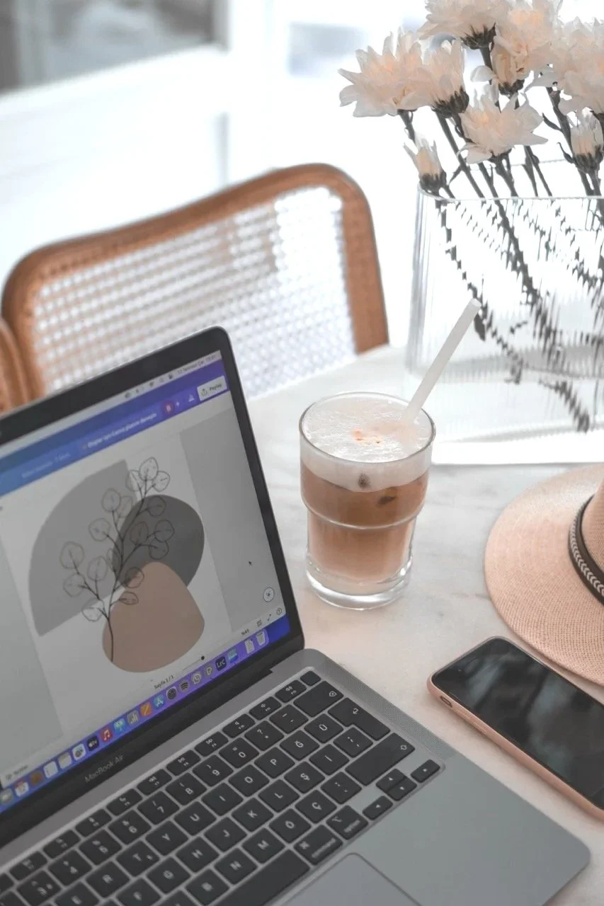 Desk setup used for designing Squarespace websites for small business clients