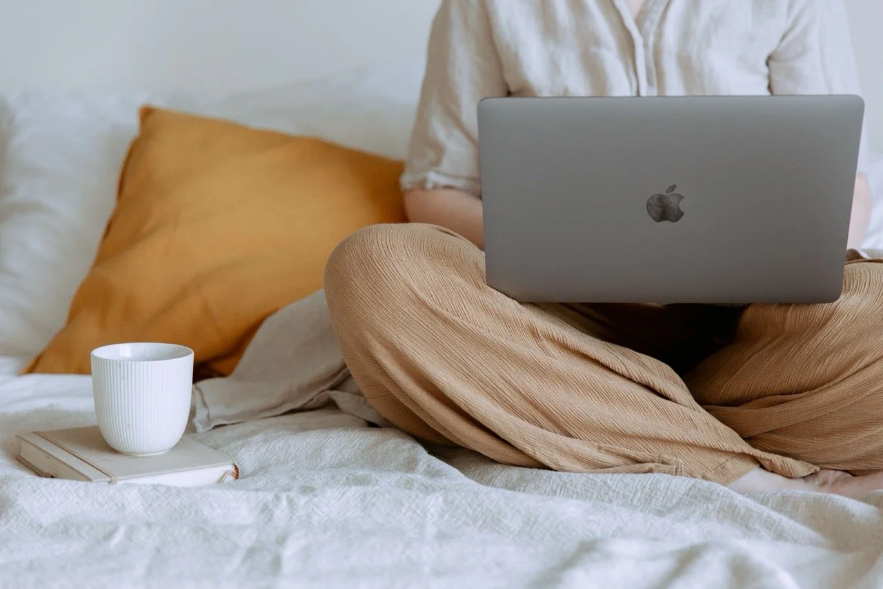 Jenna Dee working remotely from home while designing a client website