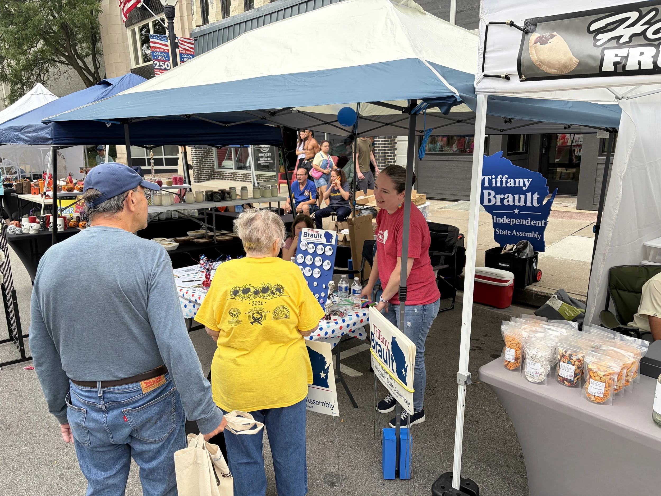 Tiffany Brault talking to voters at Fondue Fest
