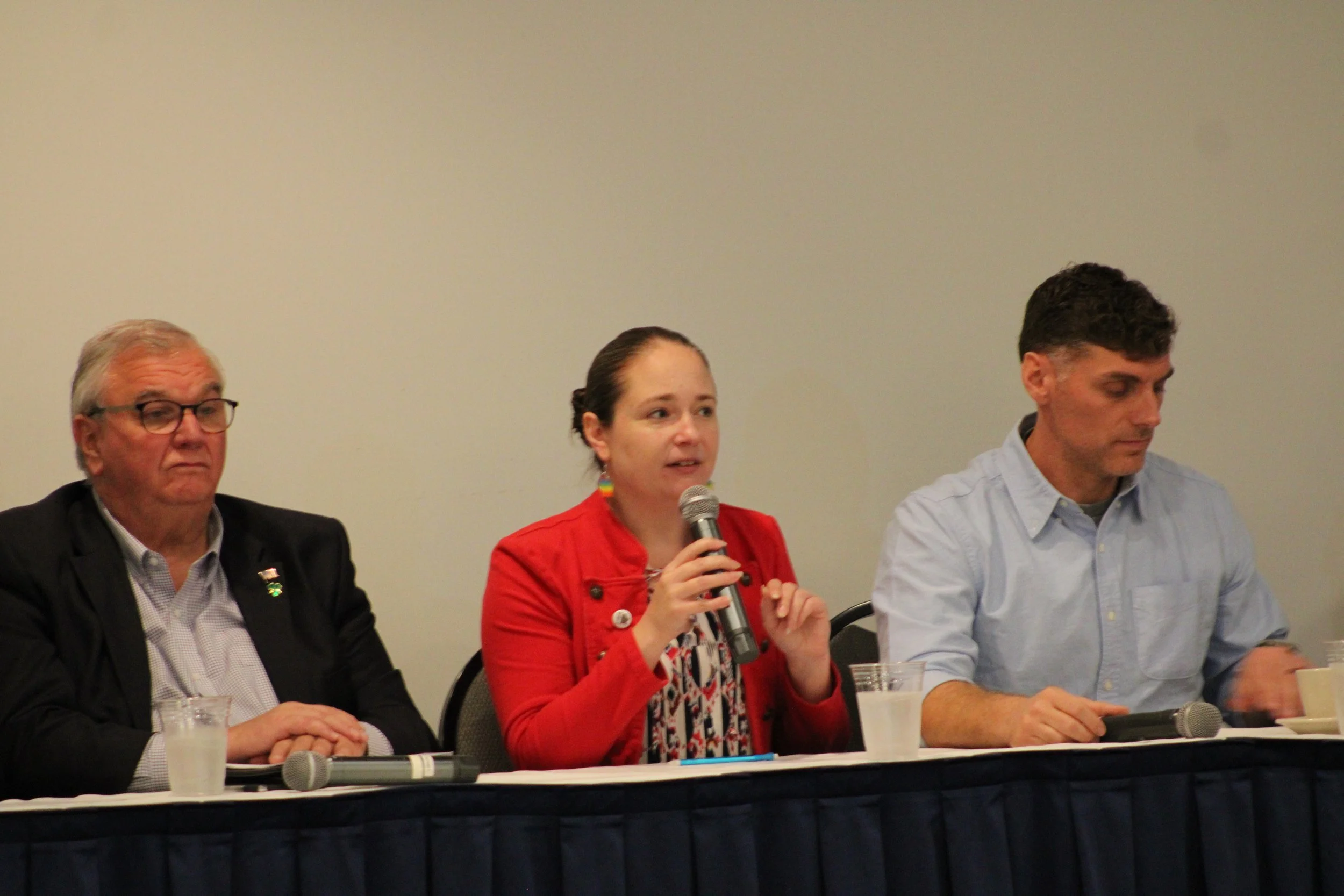 Tiffany Brault speaking during a candidate forum