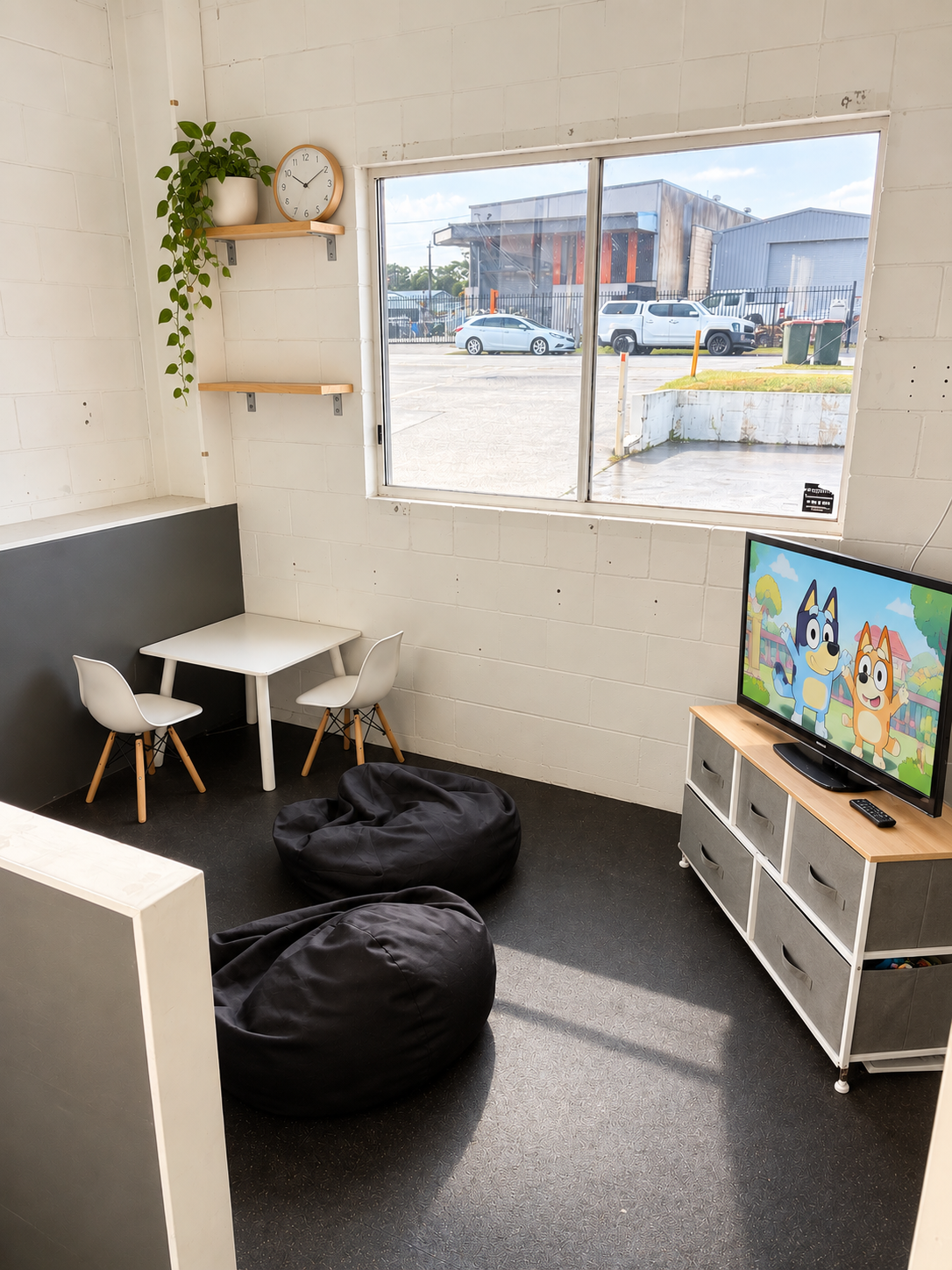 kids play area at ignite martial arts academy on the sunshine coast featuring toys, seating, and entertainment for families and siblings during class times. parents can watch their kids stress free