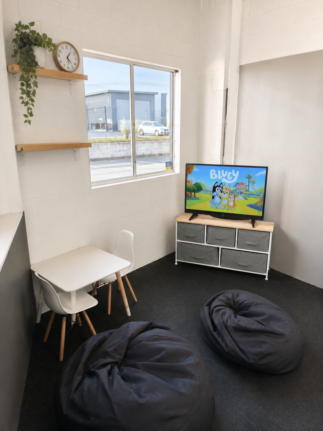 kids play area at ignite martial arts academy on the sunshine coast featuring toys, seating, and entertainment for families and siblings during class times. parents can watch their kids stress free