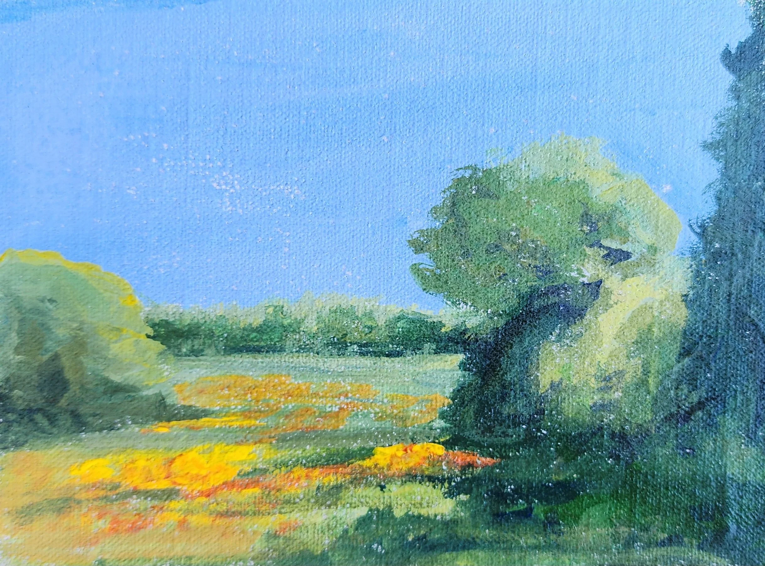 Gamboge by Nina Cobb Walker—landscape with yellow an orange flowers in the foreground, green trees to the right and left and smaller in the background with a very blue sky.