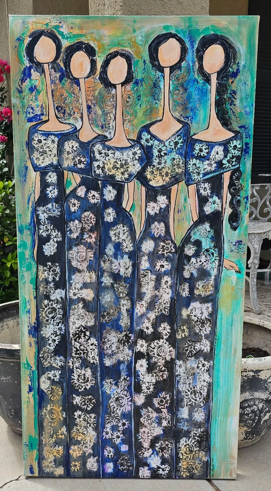 Abstract painting of five women with faceless heads, wearing dresses with floral and gear-like patterns in black, white, and shades of blue, set against a multicolored background.