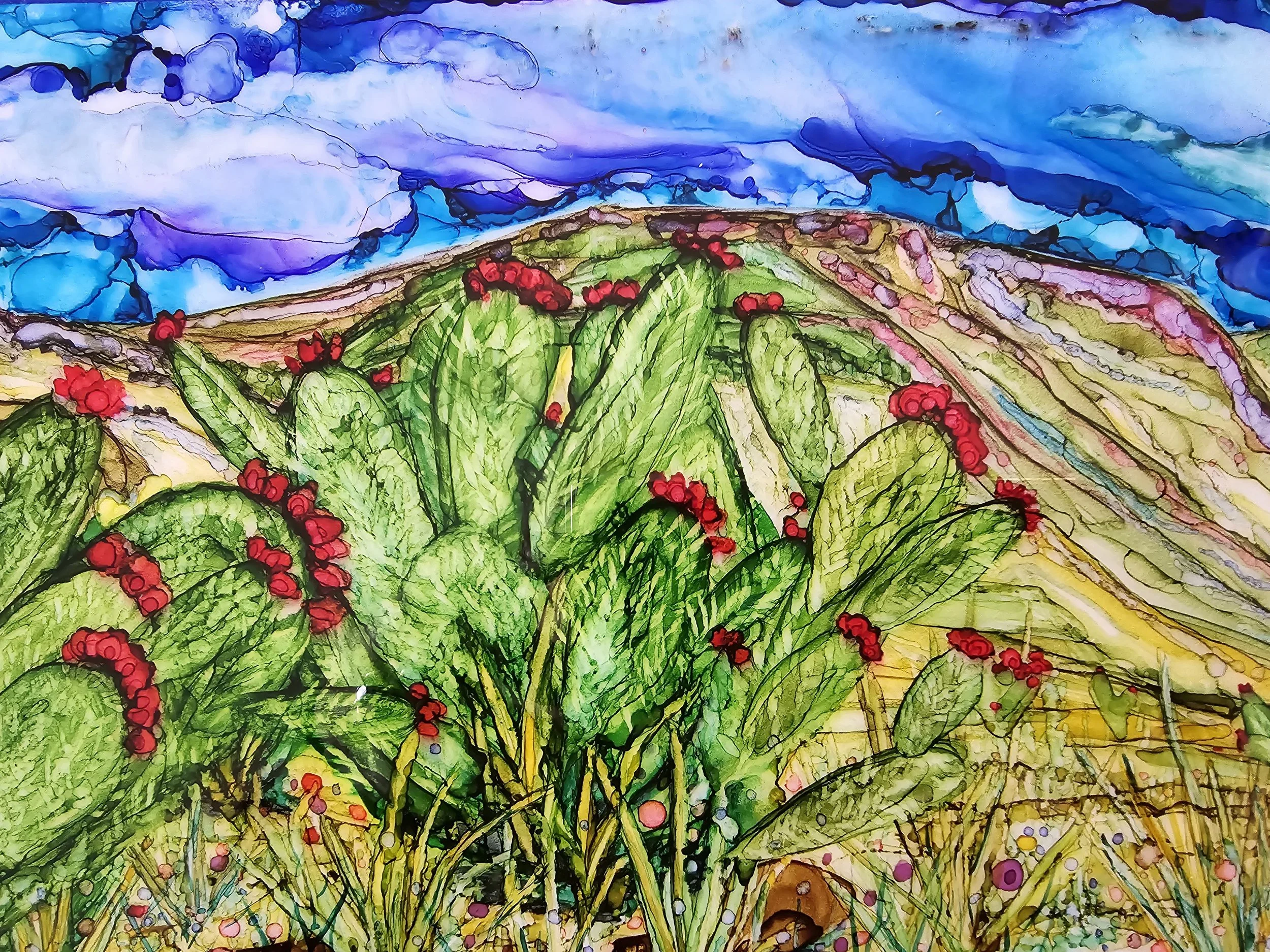 Colorful abstract painting of a green landscape with red flowers and a blue sky with clouds.