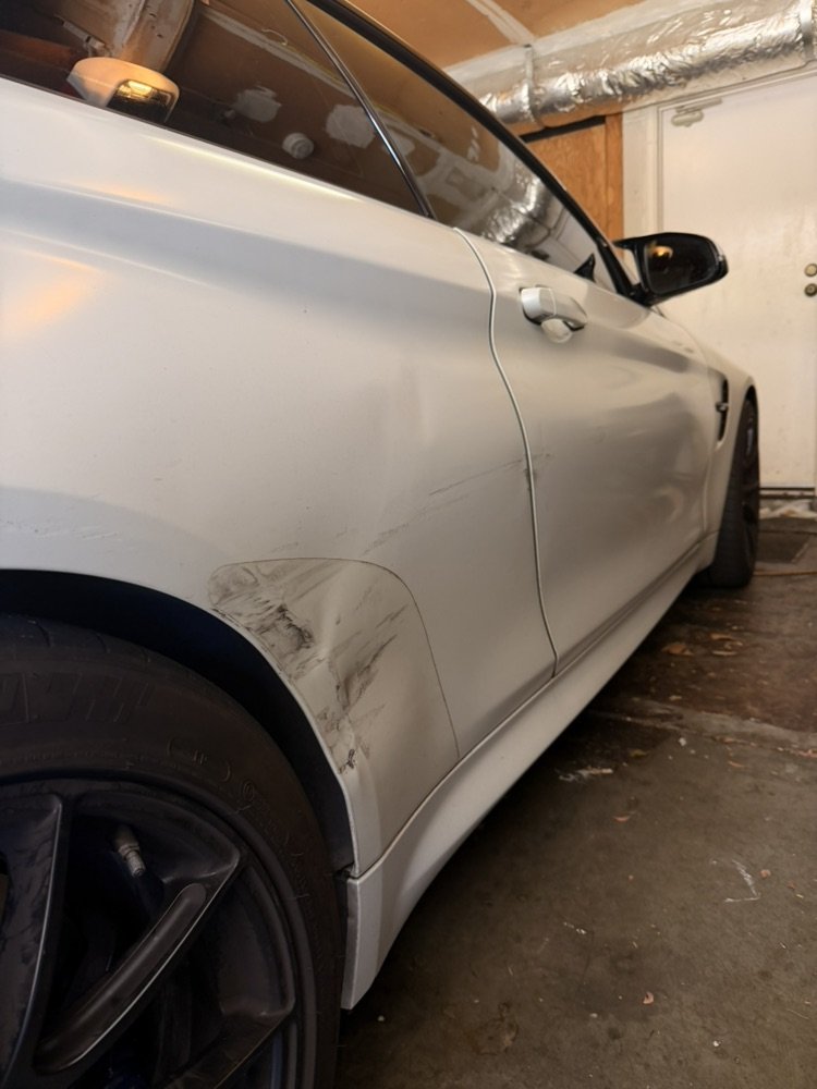 Severe quarter panel damage to this BMW M4