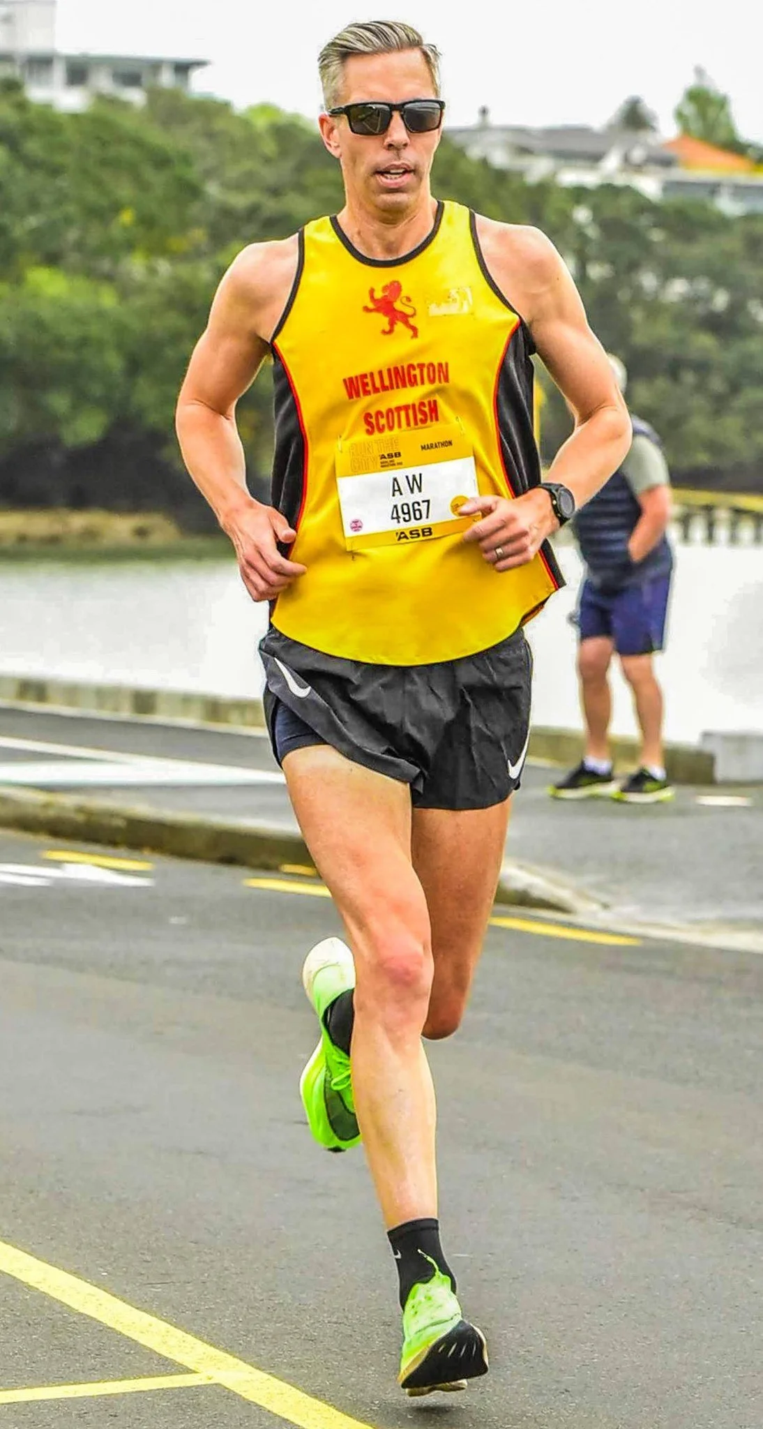 Andrew Wharton racing a marathon in a Wellington Scottish singlet