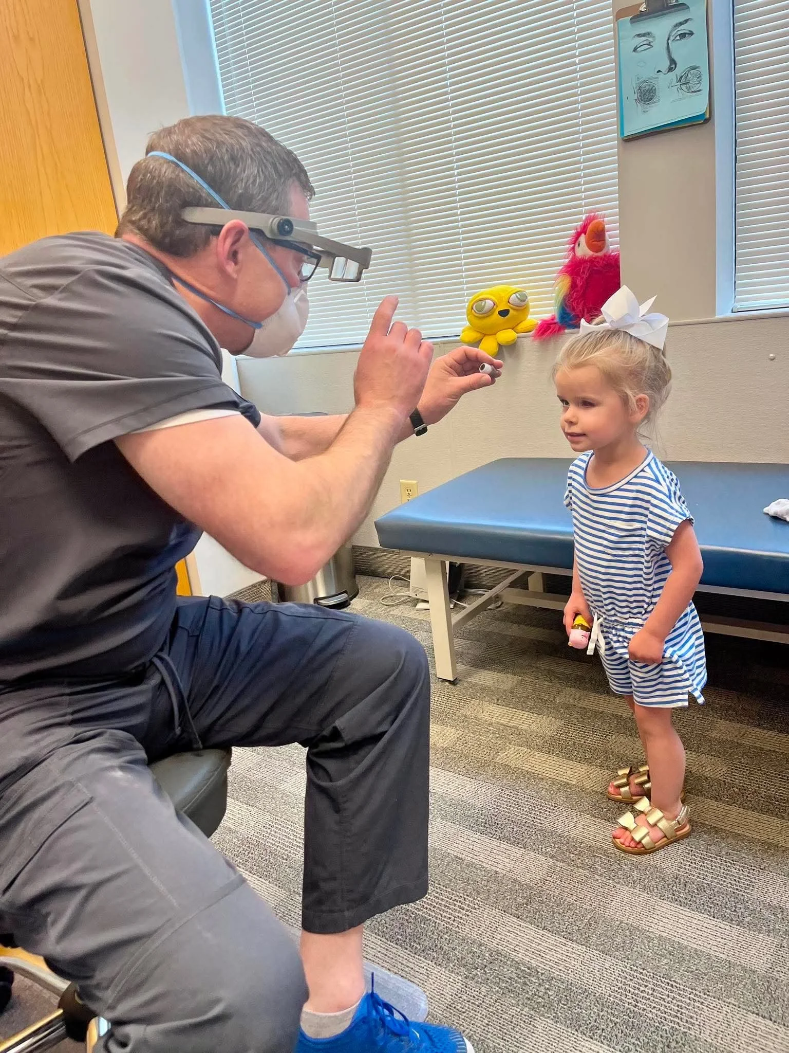 Little girl getting fitted by an ocularist for an ocular prosthetic