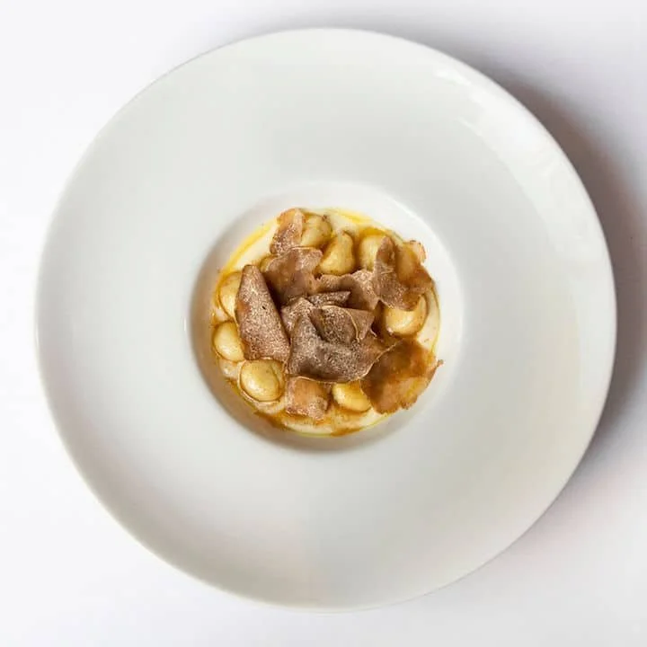 Premium Italian pasta dish topped with fresh brown truffle shavings at Giando.