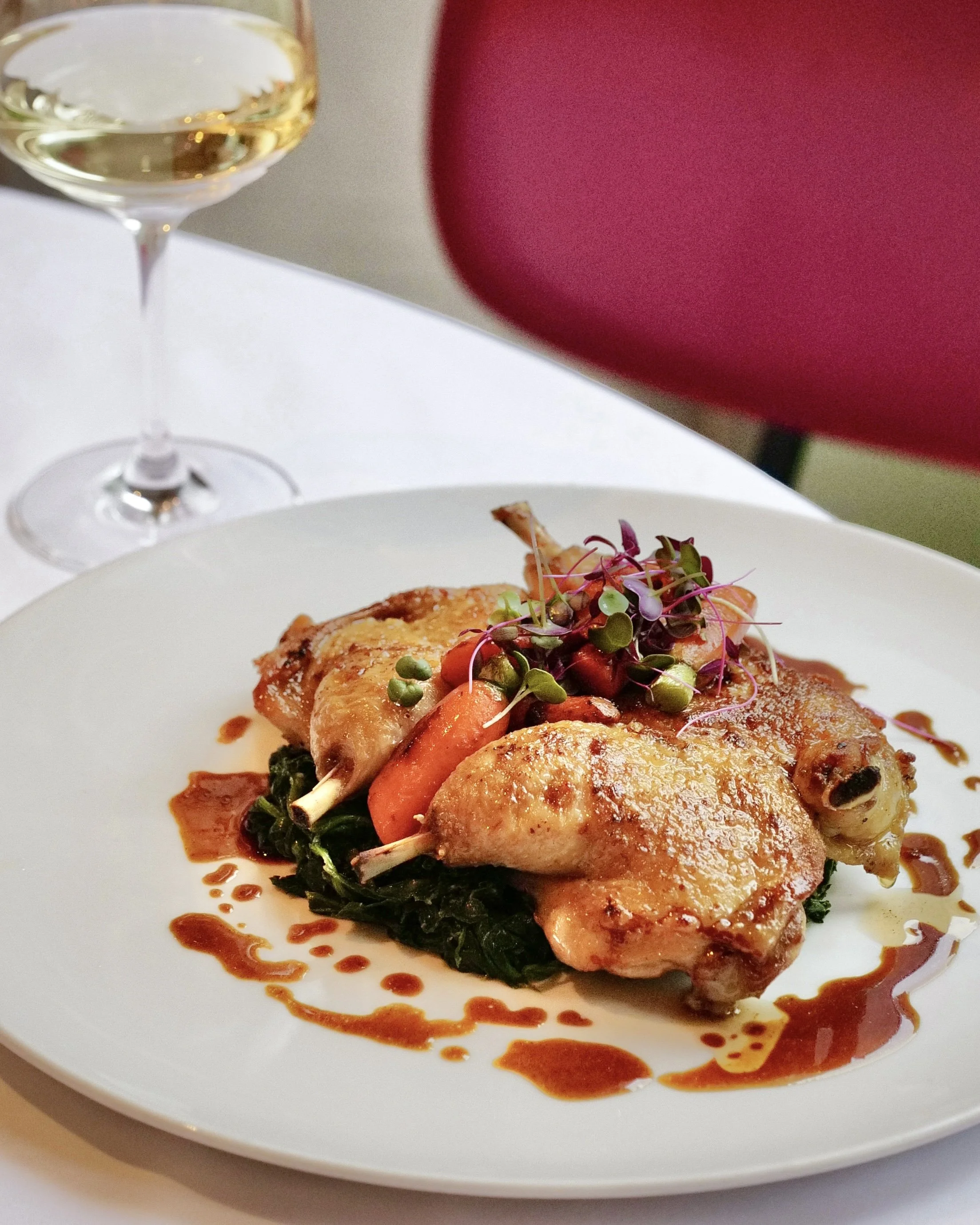Gourmet chicken main course beautifully plated at Giando.