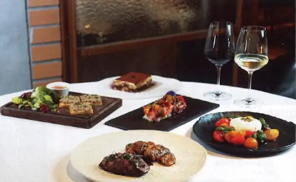 A selection of premium grilled meats, salads, and wine at Giando.