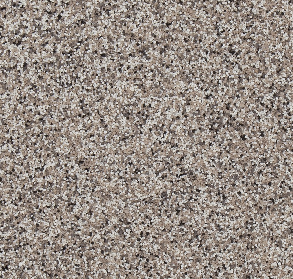 Close-up of a large pile of small, round, beige and white grains of sand.