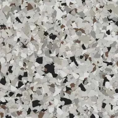 Close-up of a terrazzo floor with white, black, and gray speckled pattern.