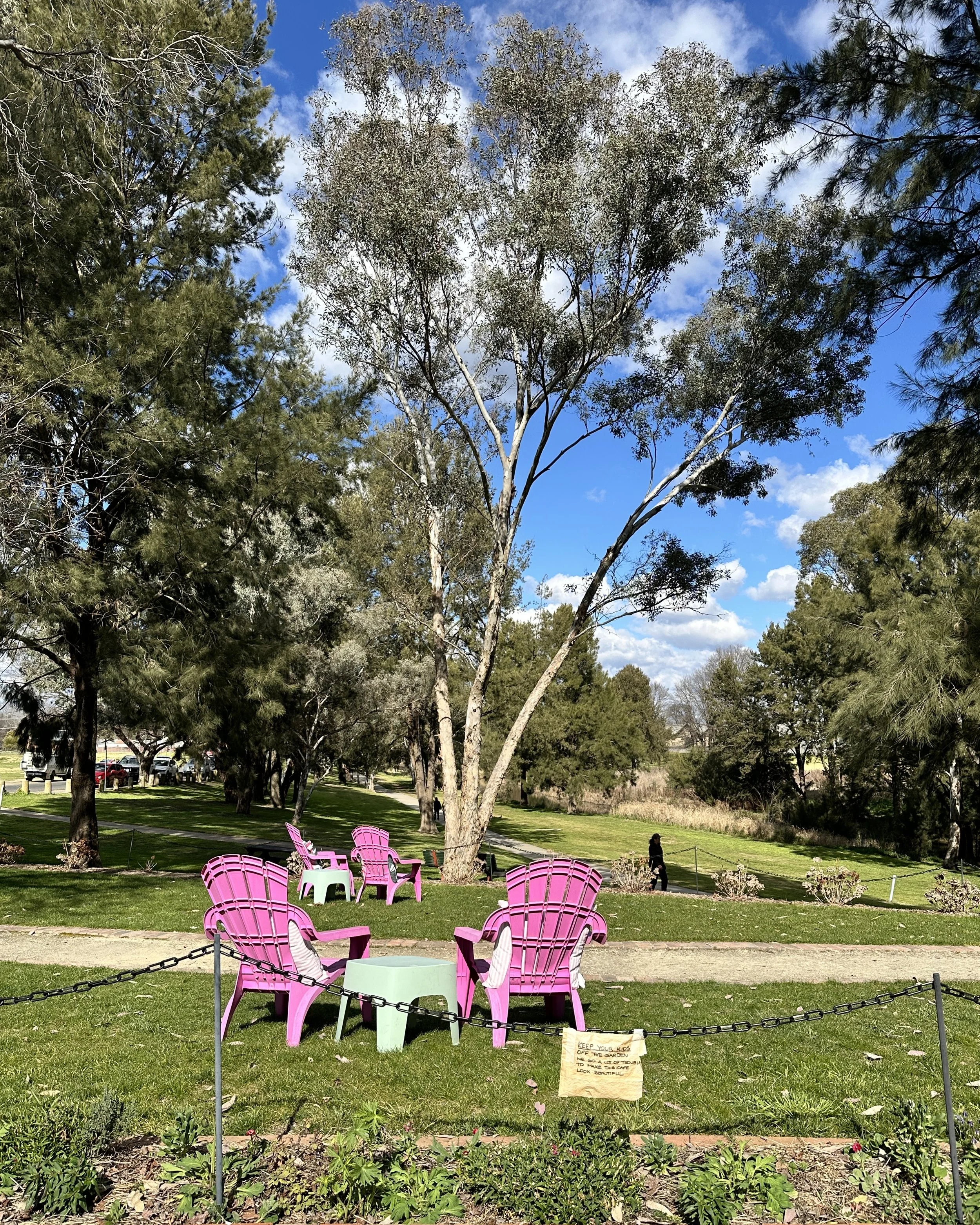 Pink deck chairs on the River Cafe lawn, Bathurst