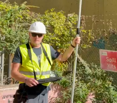 The EdgeRaptor field rig in use: pole camera, tablet and hi-vis