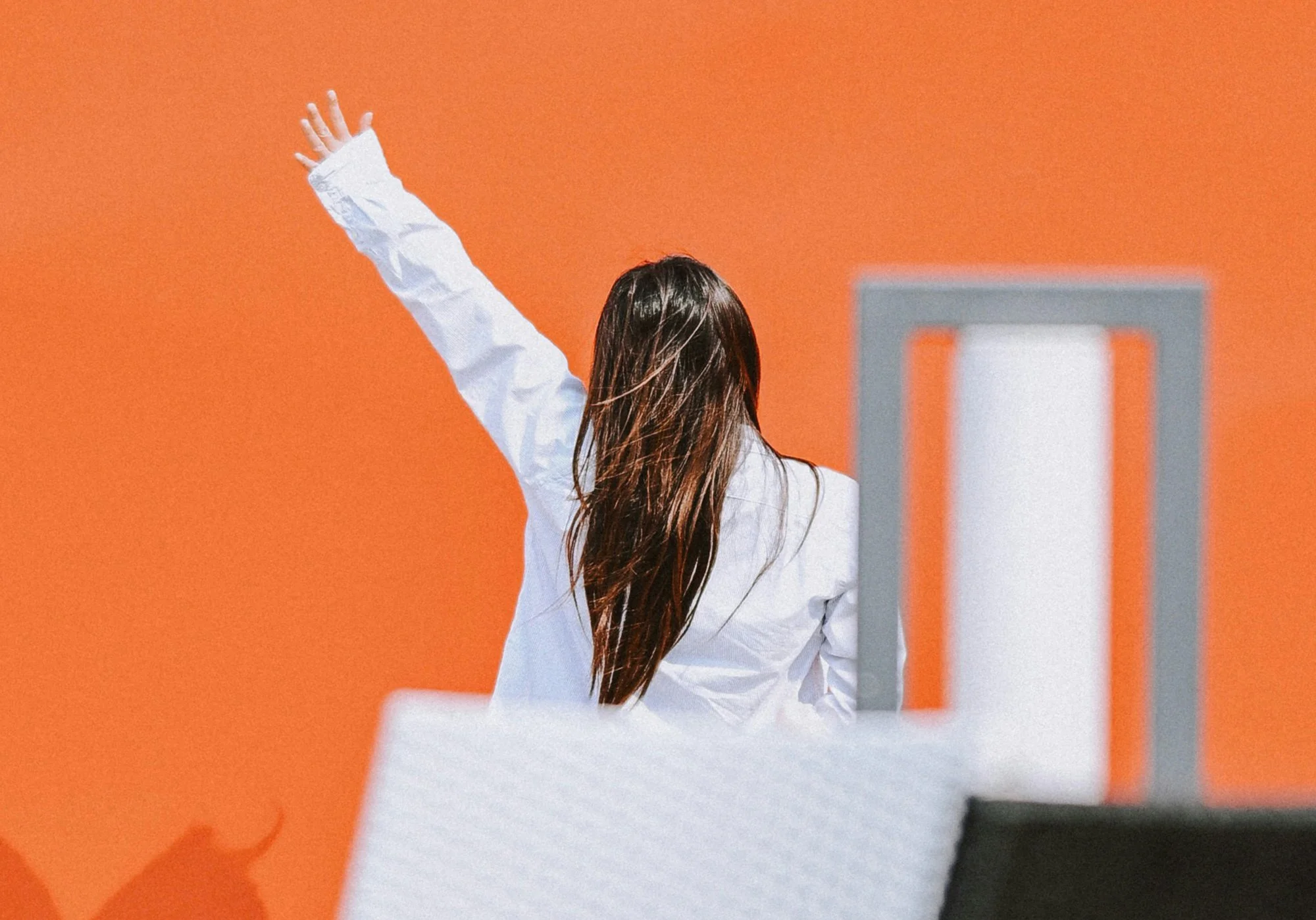 Professional woman standing confidently in a workplace environment representing women in martech leadership