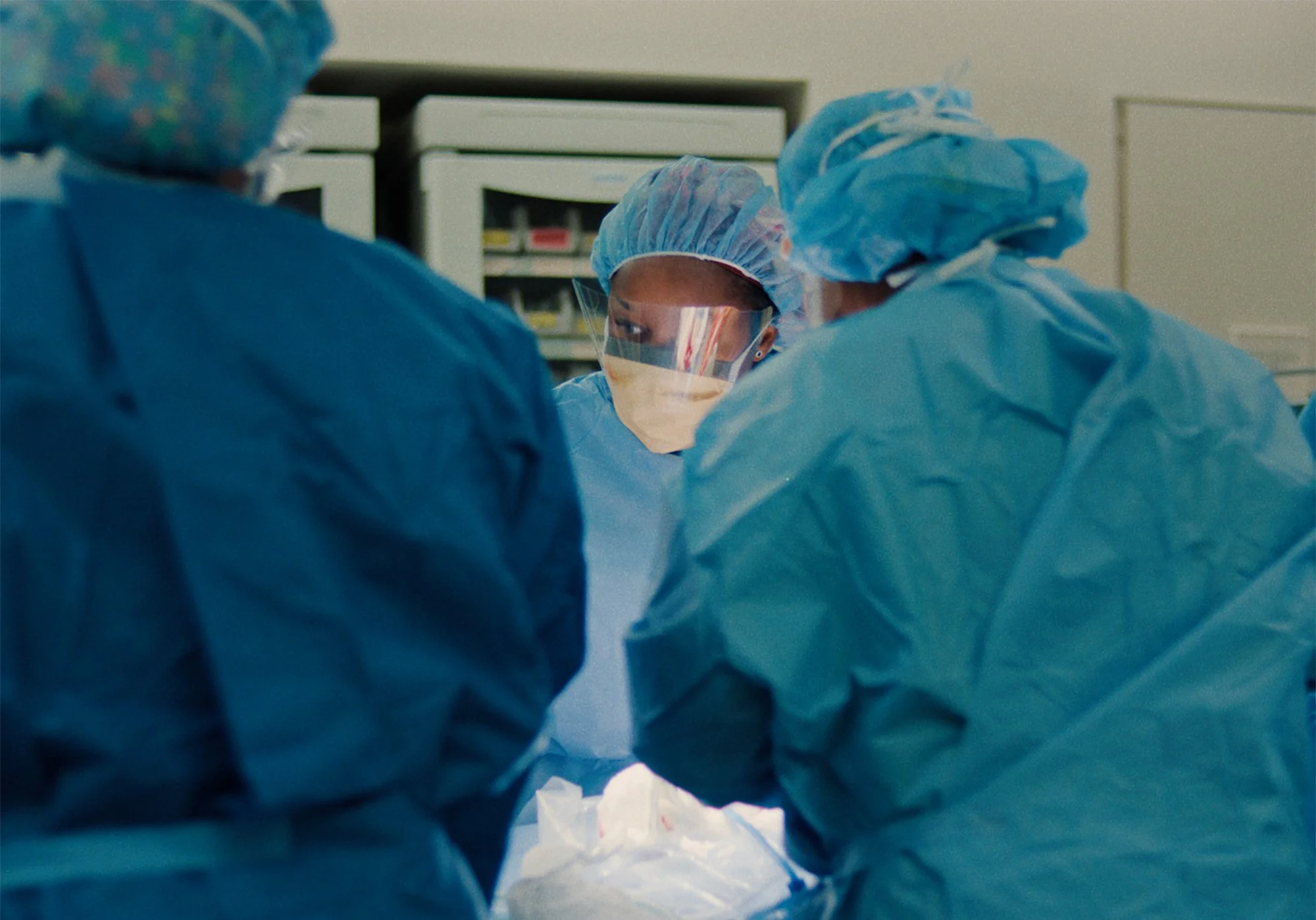 Medical professionals performing a procedure in a rural healthcare setting featured in Doc Albany