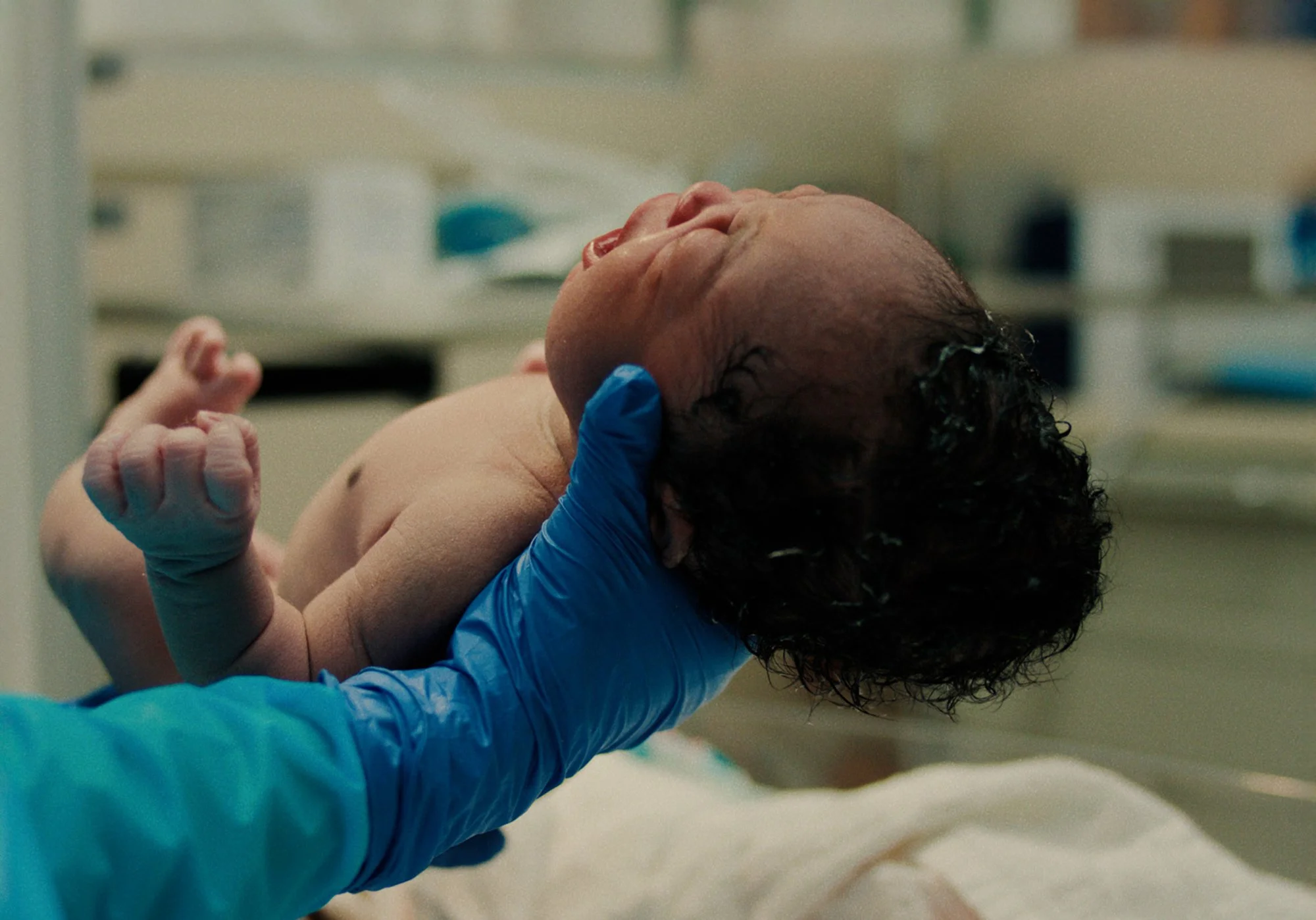 Newborn infant receiving medical care representing healthcare transformation and access