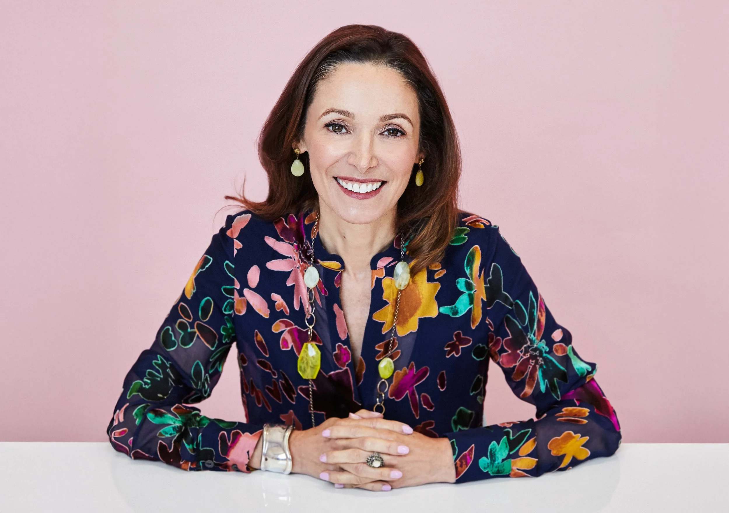 Teresa Barreira, transformational business leader and AI transformation executive, in a professional portrait.