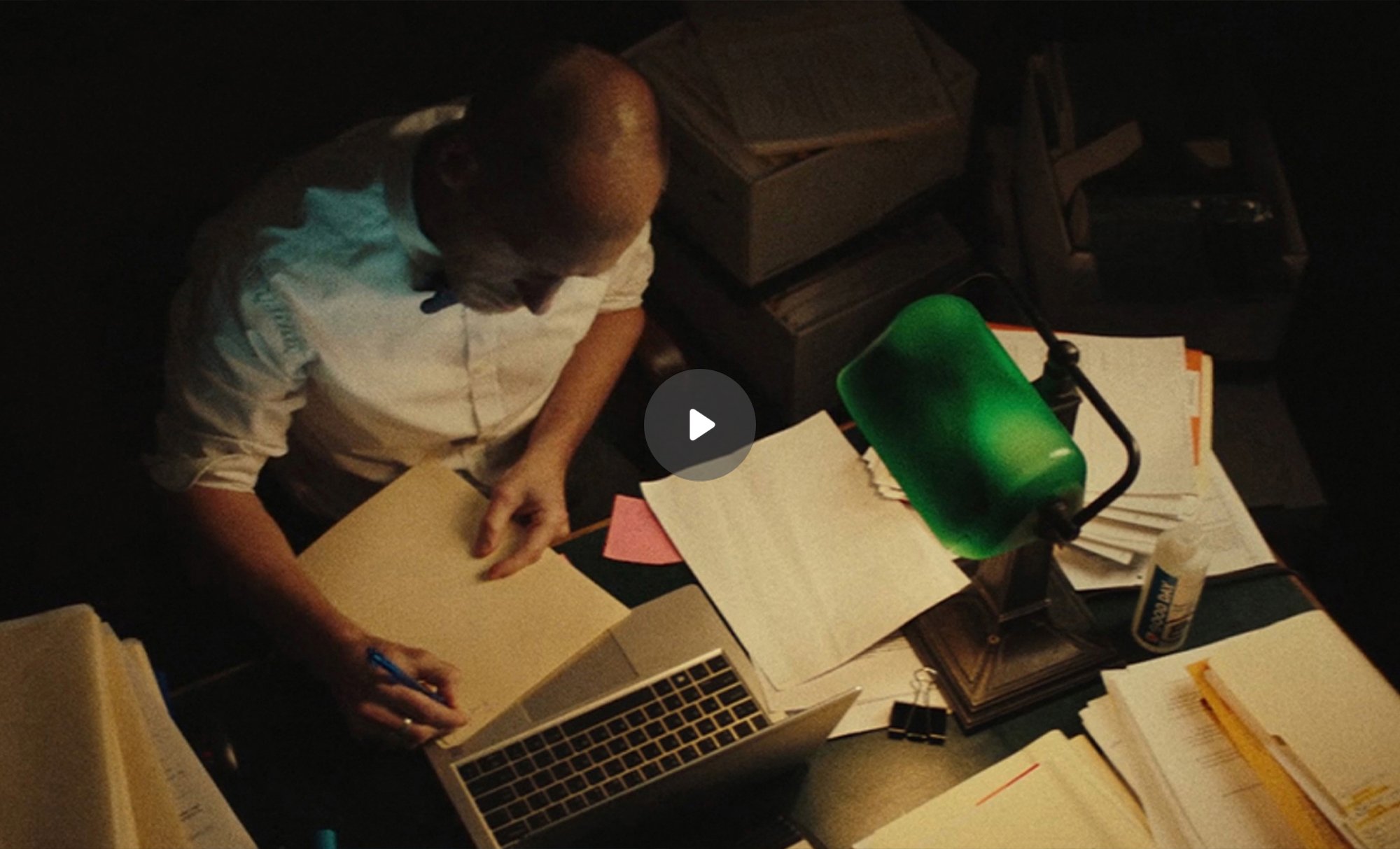 Los Angeles County Deputy Public Defender Noah Cox reviews case details at his desk in a scene from the documentary short film Forgiving Johnny.