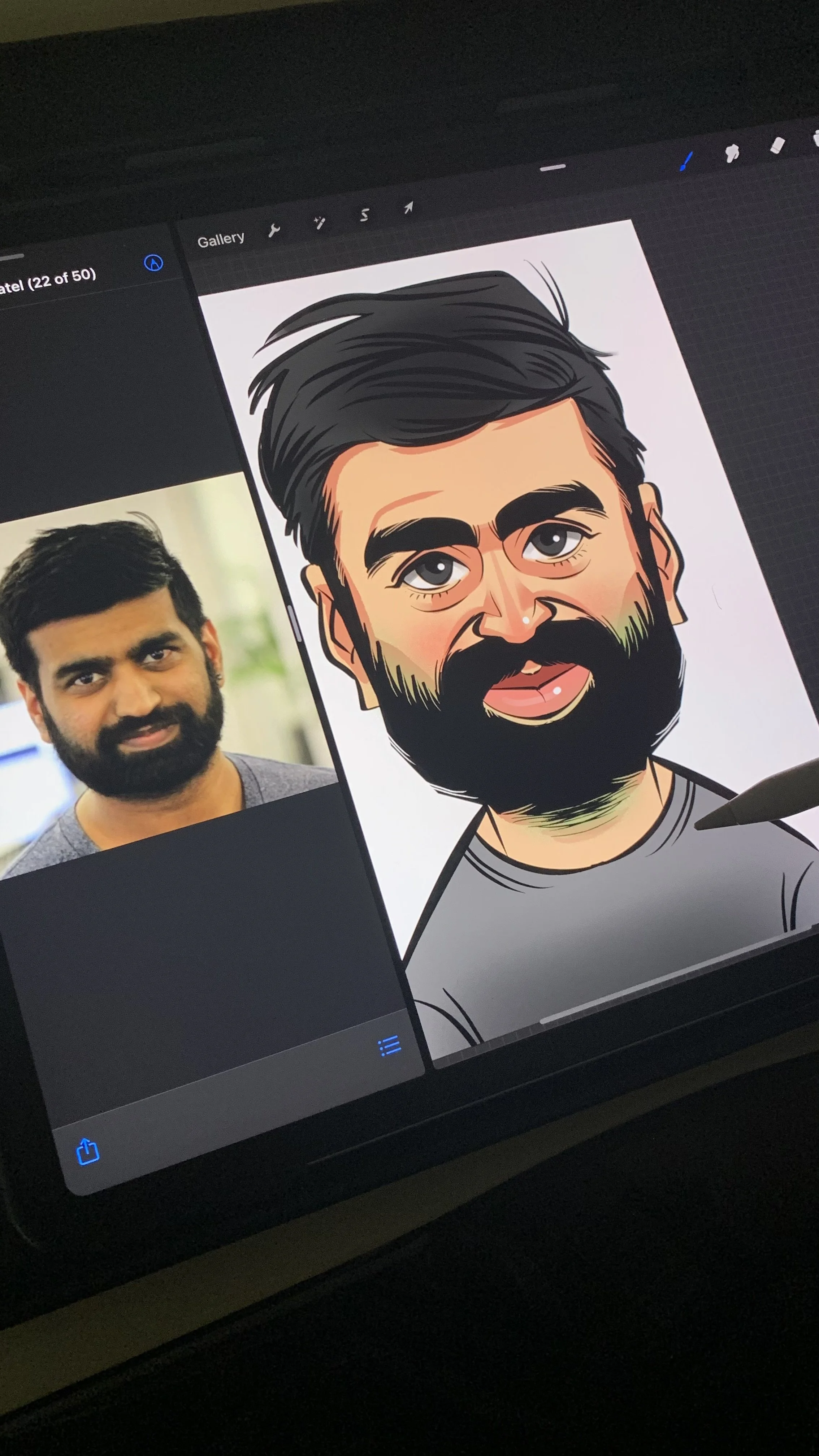 Virtual Caricature by Olylukis of a man with dark hair, beard, and mustache, wearing a gray shirt, with a photo of the same man on the left side of the screen.