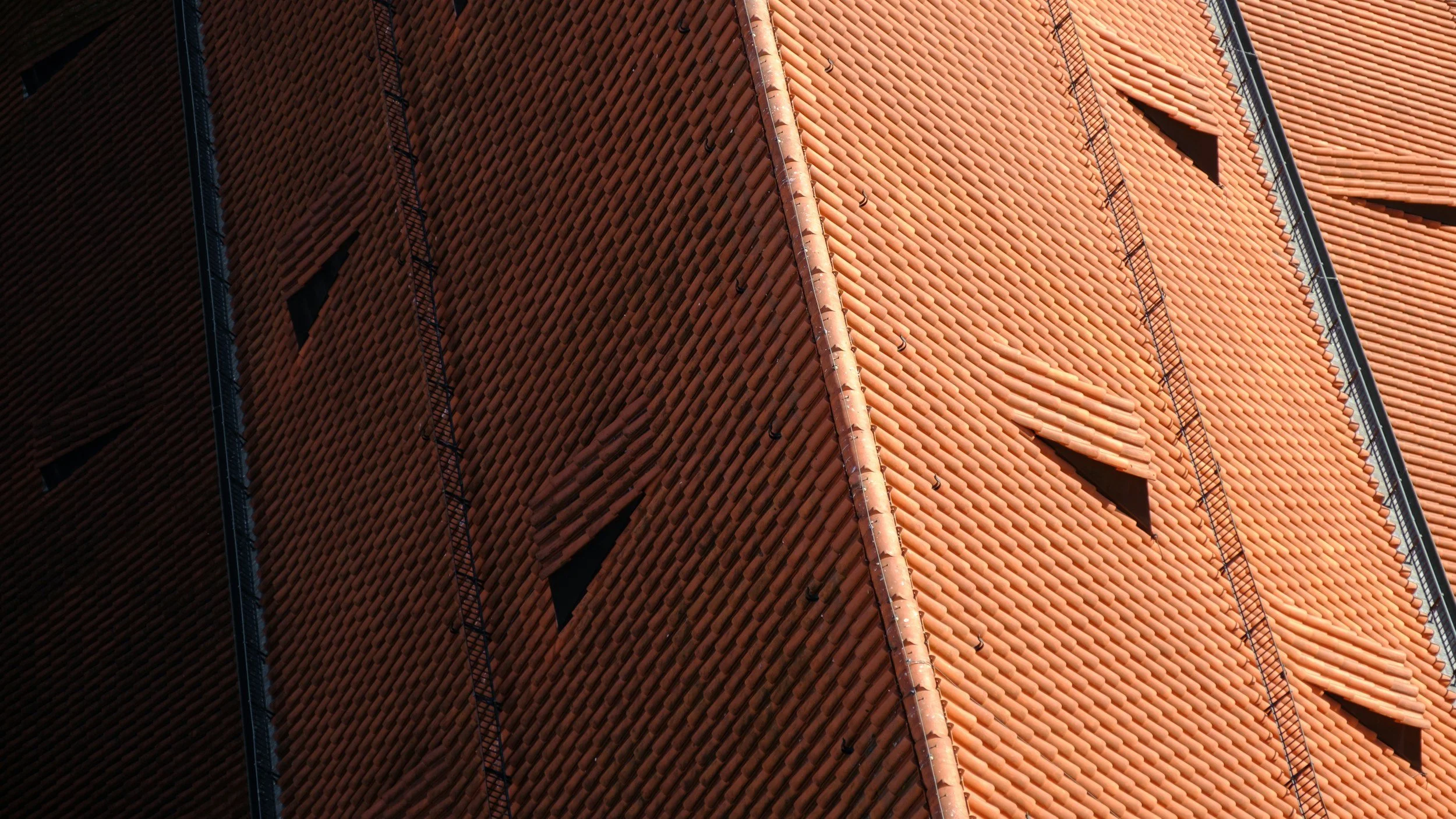 Close-up of red roof tiles on a residential property in Solihull — Radian Roofing
