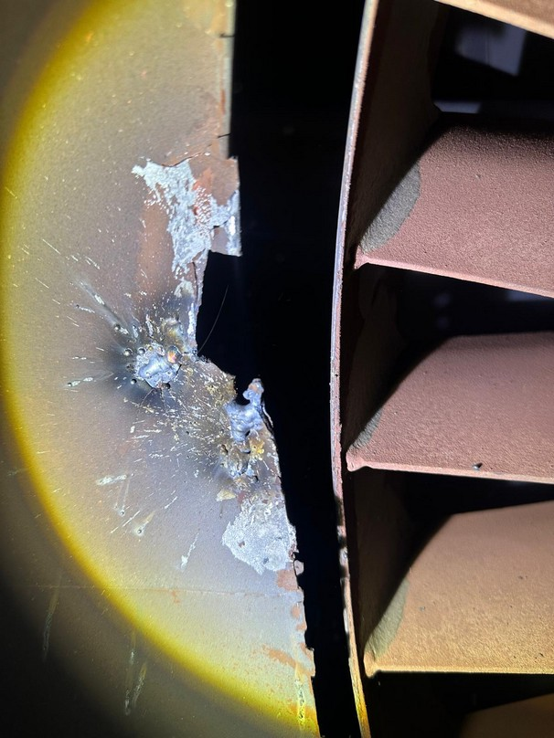 Material loss beside the circulation-fan inlet recorded during a BOS inspection.