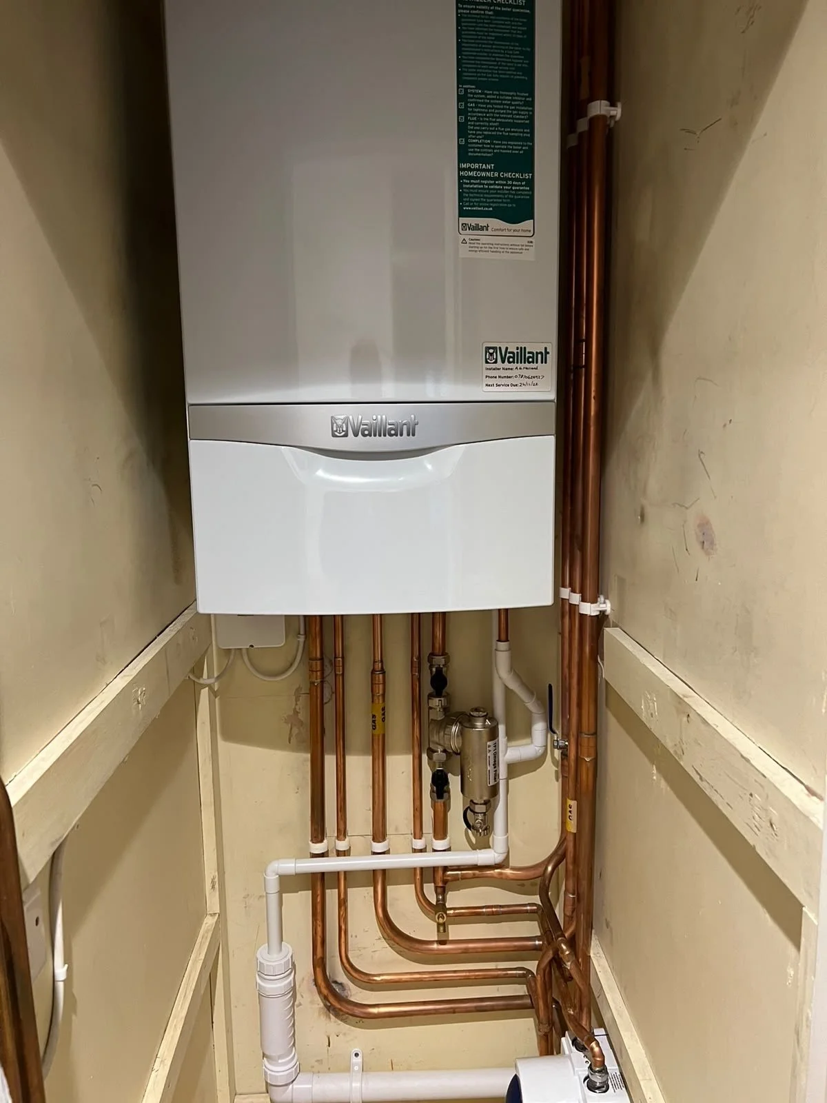 Compact Vaillant boiler replacement mounted in an airing cupboard in Bury St Edmunds
