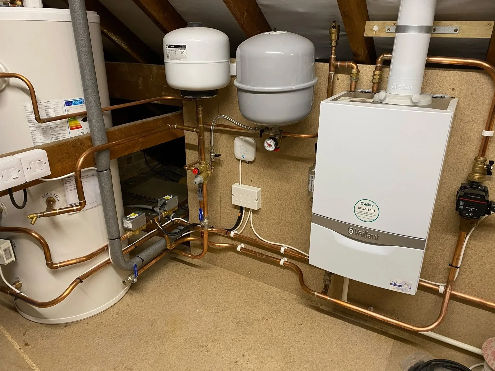 Compact Vaillant boiler & Hot Water system replacement mounted in loft space in Stowmarket