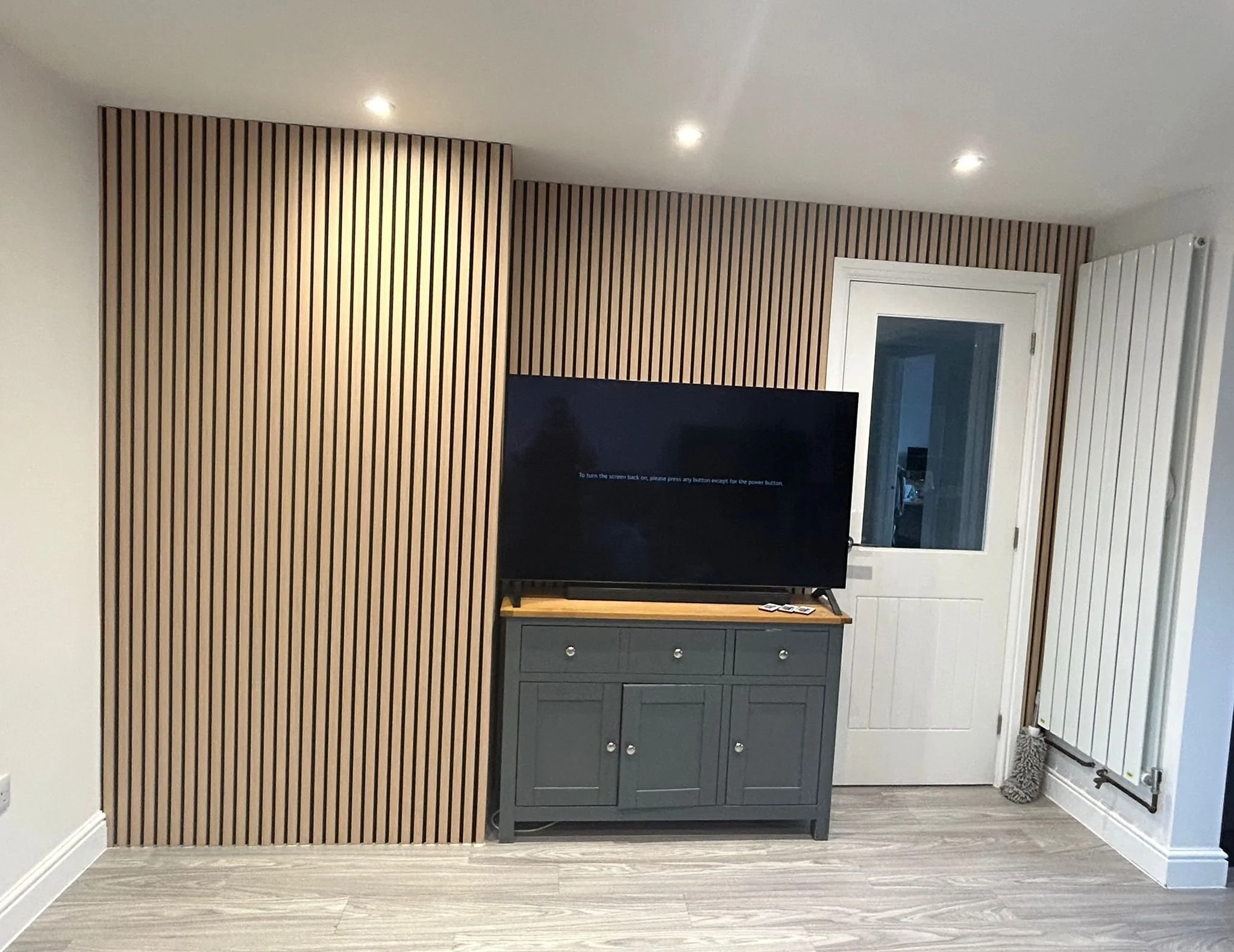 living room floor to ceiling wood panelling supplied and installed in Stowmarket