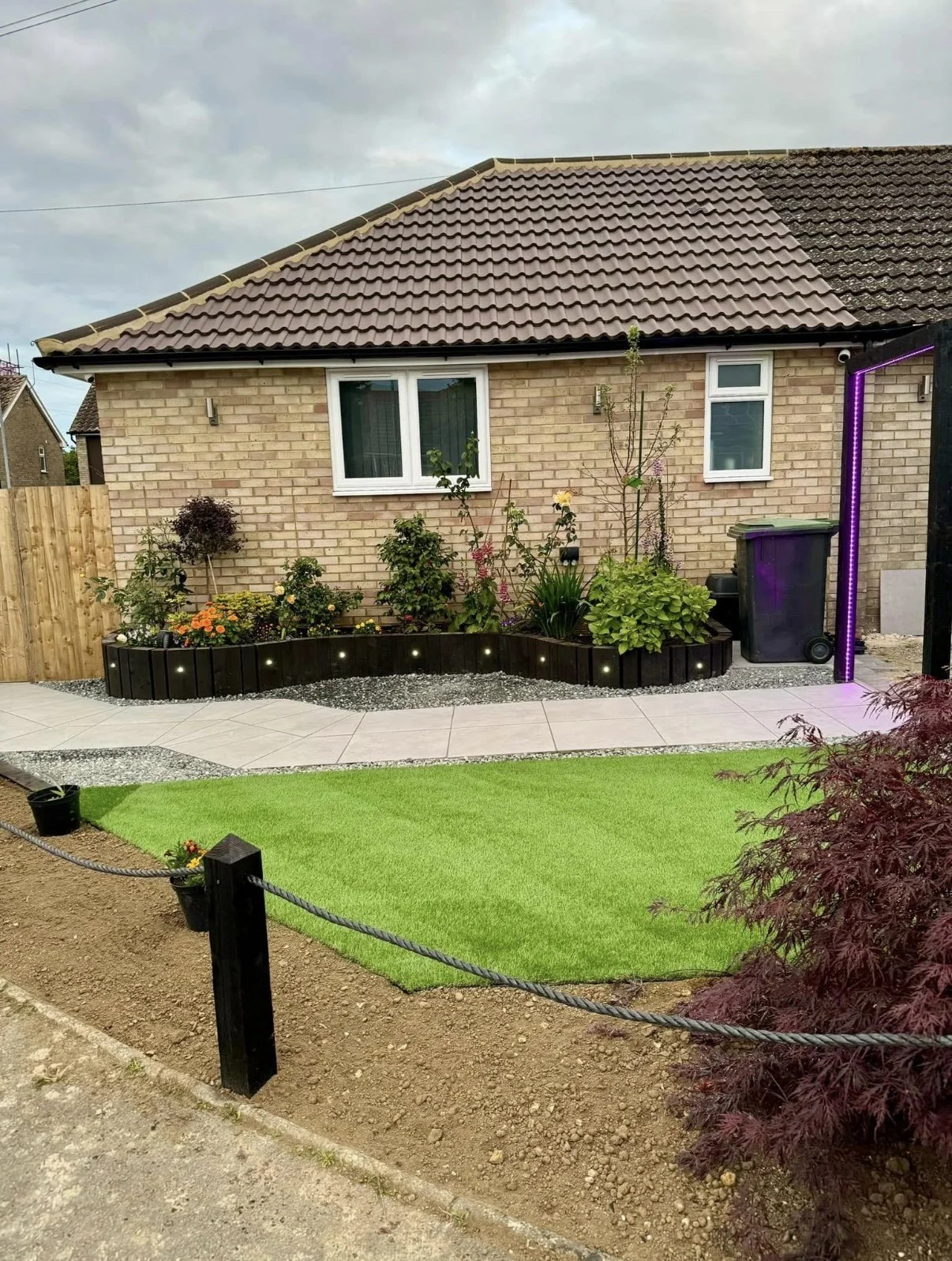 Fresh new front garden, hand crafted sleepers and posts to make this house pop. Completed in Haughley