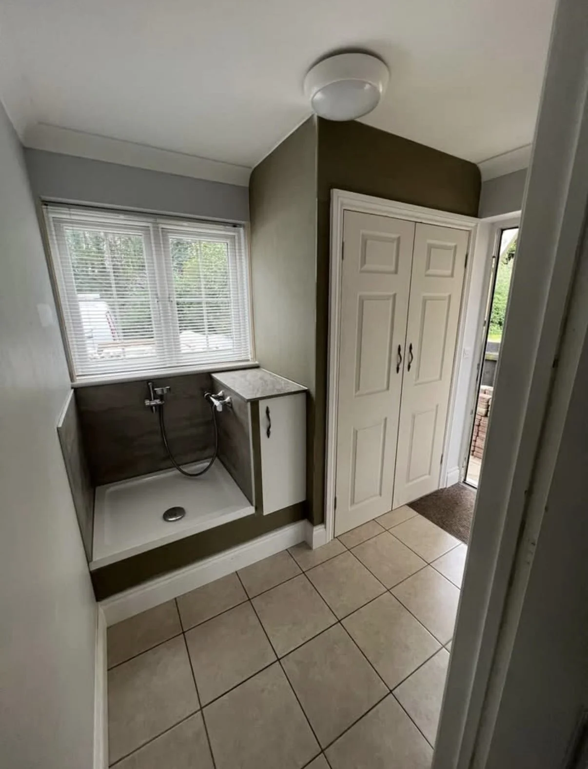 Dog Shower constructed along side utility and storage cupboard, completed in Norton