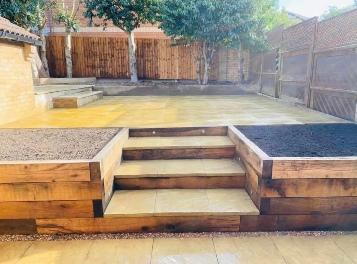 we want a new garden look, sleepers, raised patio area and nice steps, of course, nothing we cannot do! Check this one out! Landscape completed by Holland & Holland Services. 