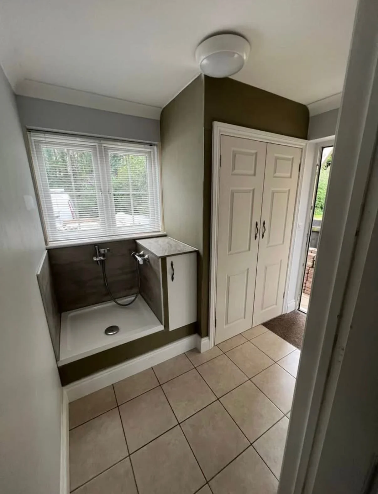 Dog shower for your house with a utility/store cupboard, not a problem! Designed and installed by Holland & Holland Services. 