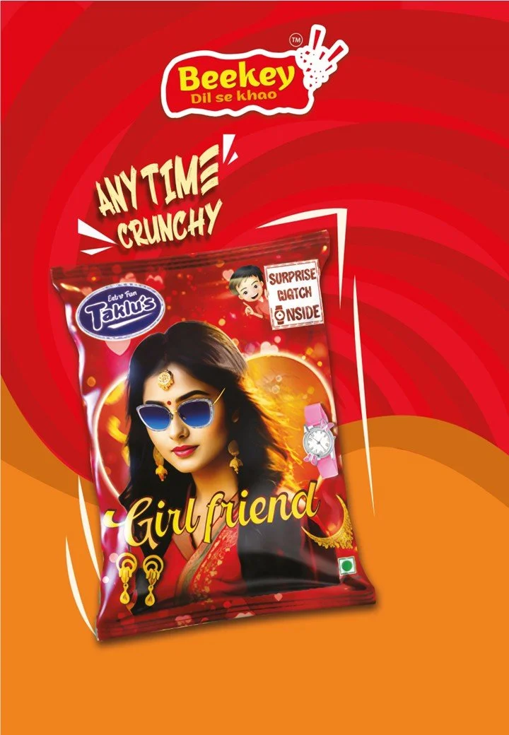 Bright red snack package labeled "Girl friend" with a woman wearing sunglasses and traditional Indian jewelry, and the text "Any time! Crunchy!" surrounding it.