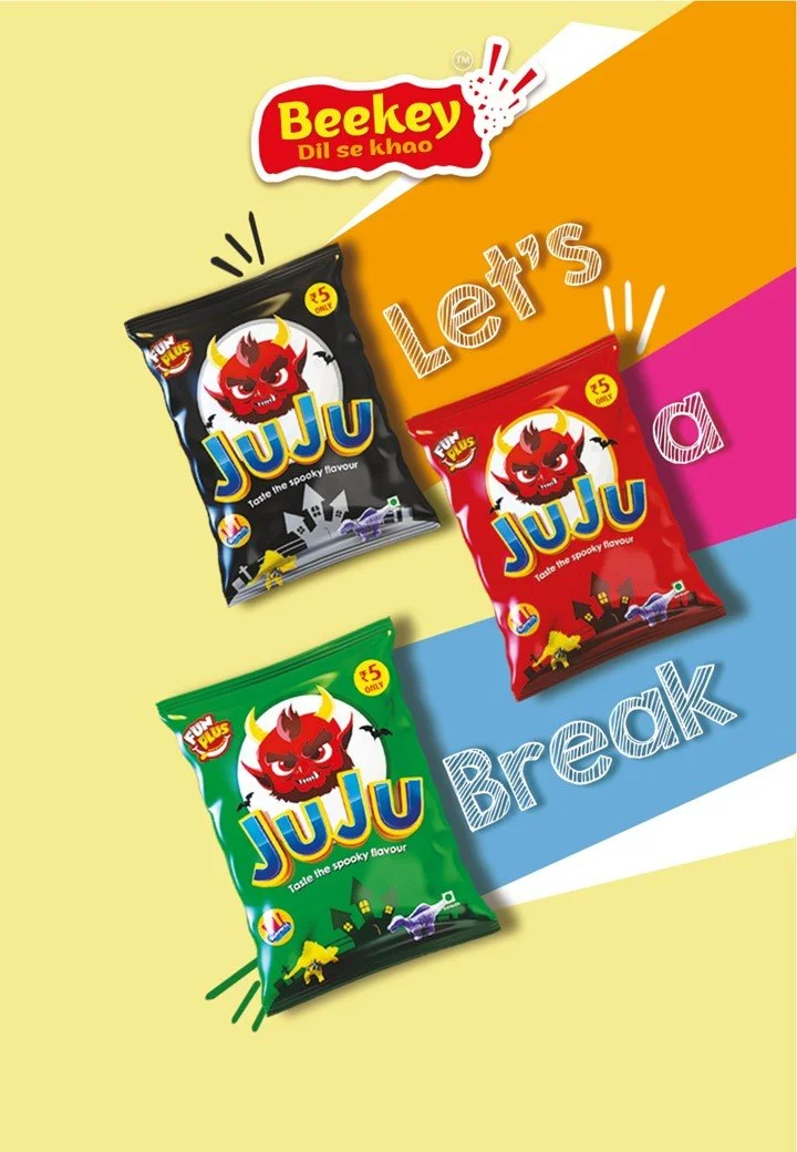Three packets of JuJu candies in black, red, and green packaging with a red devil mascot, set against a colorful background with diagonal yellow, orange, pink, and blue sections. The words "Let's a Break" are written across the image.