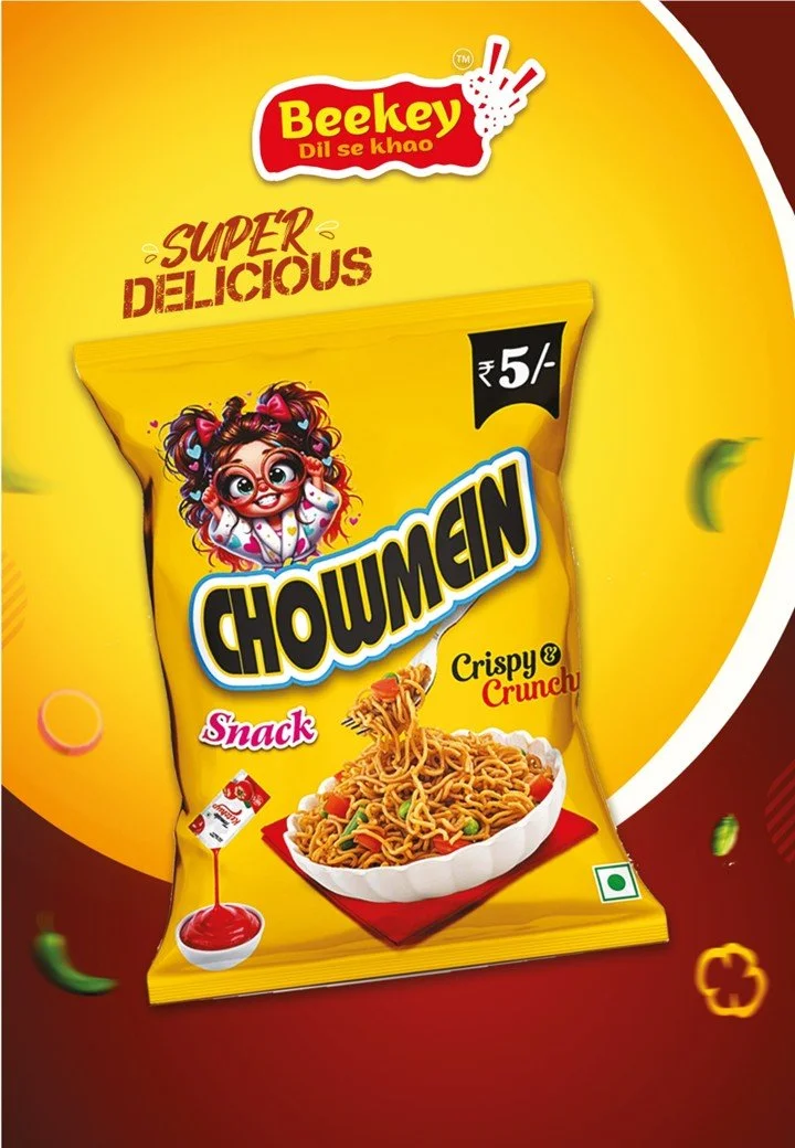 Yellow packaging of a snack called Chouwmein, priced at 5 rupees, featuring a bowl of noodles with vegetables, a cartoon girl with glasses and colorful hair, and branding elements in bright colors.