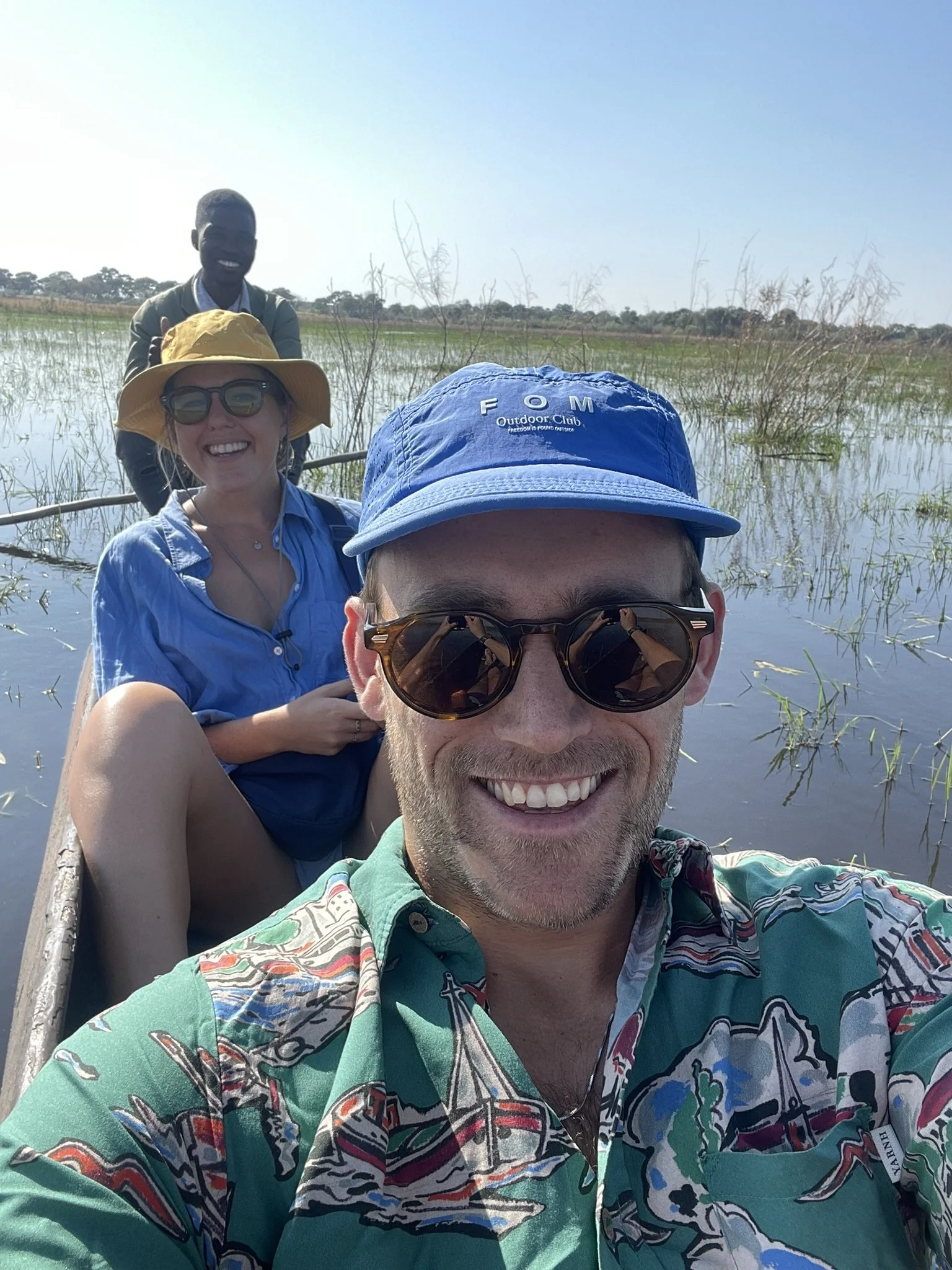 Hugo Morrissey, founder, and his partner on a Mokoro boat going along the Okavango Delta in Botswana.