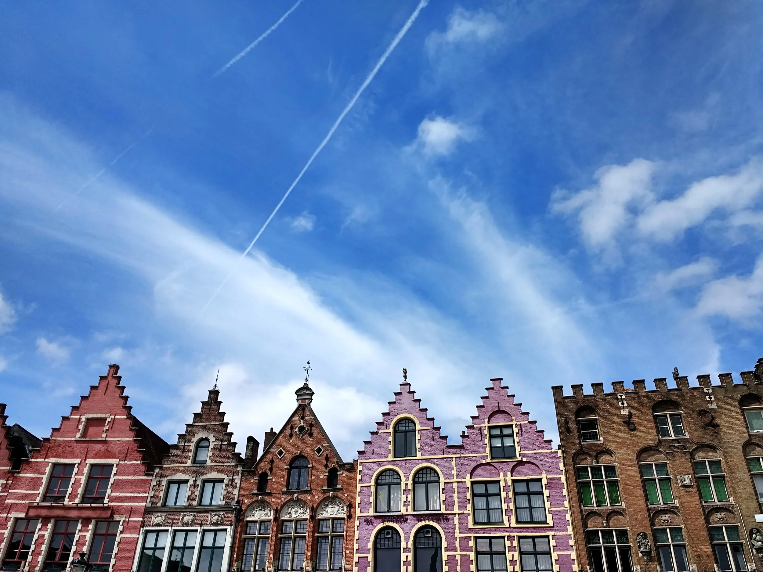 grote-markt-blue-sky-sunlight-bruges-belgium.jpg