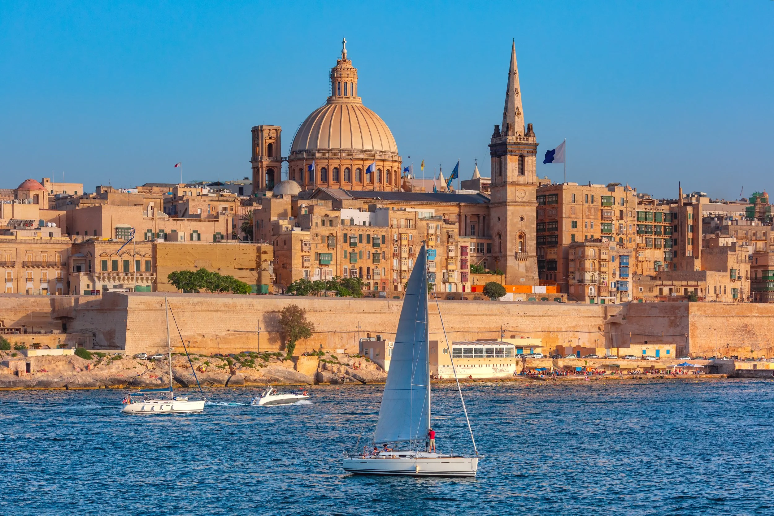 white-yacht-old-town-valletta-with-churches-our-lady-mount-carmel-st-paul-s-anglican-pro-cathedral-valletta-capital-city-malta.jpg